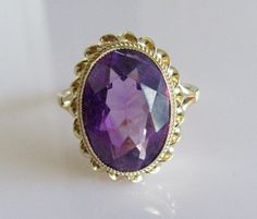 This is a stunning vintage 9ct gold ring, set with a large oval amethyst that measures 14mm by 10mm by 4mm which has been professionally cleaned and polished. It is a UK size N or a US size 6 1/2, the band with is 1.5mm. Hallmarked 9ct gold (375) made in Birmingham in the year 1972 it weighs 3.2 grams. PD223.. Luxury Polished Amethyst Oval Cabochon Ring, Heirloom Style Purple Oval Amethyst Ring, Formal Hallmarked Oval Amethyst Ring, Oval Hallmarked Amethyst Ring For Formal Occasions, Antique Oval Amethyst Ring, Antique Oval Purple Amethyst Ring, Formal Oval Amethyst Ring Hallmarked, Oval Amethyst Ring For Formal Occasions, Elegant Purple Amethyst Ring Oval Cabochon