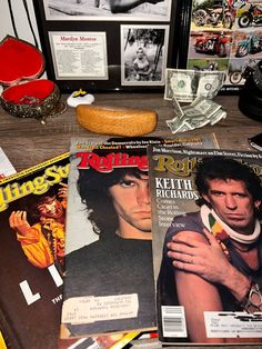 several magazines and other items on a table