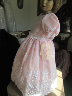 This is a high quality childs dress, it is white embroidered organza over peach fabric,  buttons with pearl buttons in back  not used. in good condition.  size 3-4 have another one in a larger size   # 7235.  no refunds waist is approx 18 inches, length of dress shoulder to hem 32 inches Organza Princess Dress For First Communion In Spring, Fitted Princess Dress For Baptism In Spring, Fitted Short Sleeve Princess Dress For Wedding, Spring Princess Style Baptism Dress In Organza, Fitted Embroidered Dress For Baptism, Fitted Princess Dress For Summer Baptism, Organza Dress For First Communion In Spring, Elegant Embroidered Fitted Princess Dress, Lace Dresses With Floral Embroidery For Baptism