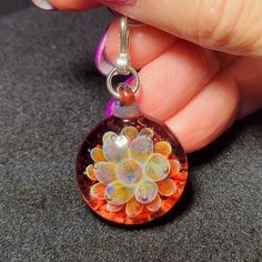 "I make each handmade blown glass ruby implosion pendant using a blowtorch and Borosilicate glass in my studio. I love the depth and sometimes, trapped bubbles I can achieve with these pendants. This design reminds me of a lotus blossom trapped in glass. Each of these pendants are one of a kind that I create out of molten glass. I only use first quality borosilicate glass and a blowtorch fueled by a mixture of oxygen and propane. Once I have the pendant finished it is placed in a kiln with a dig Lotus Blossom, Glass Necklace, Glass Blowing, Ruby, Glass Art, Bubbles, Pendant Necklace, Drop Earrings, Sterling Silver