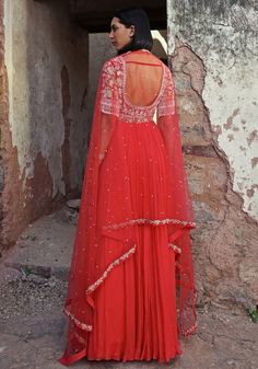 Step into elegance with the Coral Pink Anarkali. Made from georgette and chiffon, this full-length beauty features an exquisitely embellished bodice adorned with sequins, pearls, glass beads, zari, and flower applique. Completed with a soft net dupatta this Anarkali is ideal for making a statement at Mehendi and Sangeet ceremonies or as a standout wedding guest outfit. Composition : Anarkali - Georgette & Chiffon, Dupatta - Net, Satin lining Care: Dry Clean Only and Vacuum Storage This product c Transitional Party Anarkali Set With Dori Work, Anarkali Georgette, Floral Anarkali, Pearl Tassels, Coral Outfit, Pink Anarkali, Beauty Features, Vacuum Storage, Indian Wedding Wear