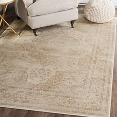 a living room area with a chair and rug