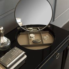 a vanity with a mirror and jewelry on it