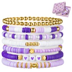 PRICES MAY VARY. Purple Stackable Bracelets: Elevate your accessory with our purple heishi bead bracelet set, featuring seven unique pieces that add flair to any ensemble. Five bracelets boast a captivating blend of gold-plated beads, purple and white clay beads, while one alternates between pearl beads and purple clay beads. The final piece features a string of gold-plated round beads, completing this stunning collection. Crafted with Care: Our purple friendship bracelets are carefully strung f Cute Clay Bead Bracelet Ideas For Mom, Clay Bead Brackets Ideas, Stitch Beaded Bracelet, Friends Themed Bracelets, Braclets Ideas Clay Beads Easy, Purple Beads Bracelets, Cute Clay Bead Ideas, Clay Bracelet Ideas Purple, Clay Bead Bracelet Ideas Blue And Purple