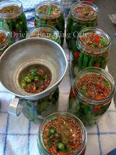 several jars filled with food sitting on top of a table