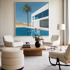 a living room filled with furniture and a painting on the wall