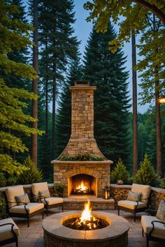 an outdoor fire pit with chairs around it