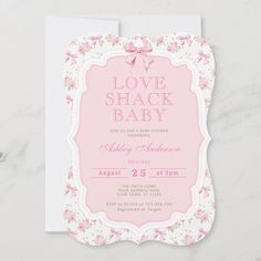 a pink and white floral baby shower card