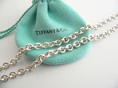 Overview:Offered for sale is a wonderful, very rare and gorgeous Tiffany & Co. Silver & Large Smoky Quartz Gemtone Toggle necklace. Definitely a Tiffany piece that you will get your money's value for. It works perfectly with pretty much any attire your put on, AND is an awesome statement piece. It is the perfect necklace that fits a lifestyle on the go -- the piece can be worn to pretty much any occasion! It is simple, elegant, and classic all rolled into one. Imagine wearing the piece with your Silver Necklaces Tiffany & Co., Designer Chain Necklace As Gift, Designer Chain Necklace For Gift, Luxury Toggle Necklace With Chain For Formal Occasions, Designer Engraved Necklaces For Formal Occasions, Luxury Wedding Jewelry With Cable Chain, Luxury Engraved Chain Necklace As Gift, Luxury Engraved Chain Necklace For Gift, Designer Oval Hallmarked Jewelry