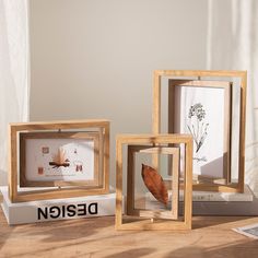 three wooden frames sitting on top of a table