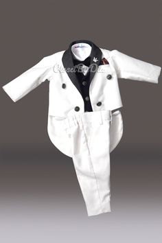 Classy and handsome tailcoat for boy in white and black is an ideal pick to grace weddings, first birthdays and christening ceremonies. Milk/ black color suit which is a 5 piece suit with pants, tailcoat, black waistcoat, shirt and bowtie. It is a timeless boy wedding outfit to dress like a royal British Prince. This wedding costume for boys is a fine work of designing. newest collection of Trendy tailcoat suits and costumes for toddler boy. Enjoy worldwide shipping with this dress tailcoat for First Birthday Outfit Boy, Prince Charming Costume, Toddler Boy Costumes, British Prince, Wedding Outfit For Boys, Birthday Costume, Prince Costume, King Outfit