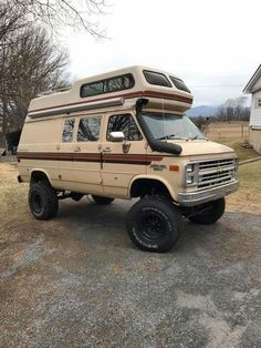 an rv parked in front of a house