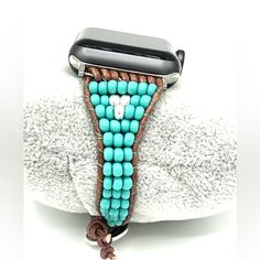 Beautiful And Unique Handmade Apple Watch Strap With Turquoise Seed Beads And Silver Accents. Made With Brown Leather Cord And Finished With A Button Closure. Watch Not Included, For Photo Modeling Only. These Connectors Will Fit All Apple Watch Series. These Bands Are Sized As Bracelets. Please Order According To Your Bracelet Size. Style Up Your Watch With This Southwest Look. Brand Name Hand Crafted Handcrafted By Me So Each Piece Is Brand New And One Of A Kind. Your Item Is Beautifully Packa Handmade Adjustable Turquoise Watch Bands, Adjustable Hand Tooled Brown Apple Watch Band, Bohemian Turquoise Adjustable Apple Watch Band, Hand-tooled Brown Leather Watch Bands, Leather Watch Bands With Adjustable Strap, Rectangular, Beaded Cuff Bracelet, Handcrafted Bracelets, Beaded Cuff, Apple Watch Strap