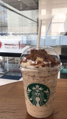 a starbucks drink with an ice cream sundae in the middle and toppings on top