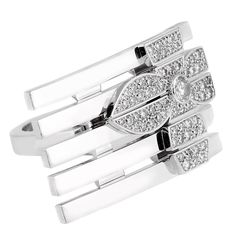 a white gold ring with diamonds on the bottom and two rows of stones in the middle