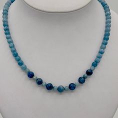 This is a Natural Gemstone Aquamarine Necklace with a mixture of different shades of blue. The beads are AAA quality, dark, medium and a lighter hue blend of aquamarine. Aquamarine is the March birthstone. This has a Sterling Silver lobster claw clasp and extender chain. It is adjustable from about 18-20”. Blue Kyanite Gemstone Bead Necklaces, Blue Kyanite Gemstone Beaded Necklace, Blue Crystal Necklace With Polished Round Beads, Blue Kyanite Round Bead Jewelry, Blue Crystal Necklaces With Polished Round Beads, Blue Kyanite Gemstone Necklace, Blue Beaded Necklaces With Natural Stones For Healing, Aquamarine Gemstone Beaded Necklace, Aquamarine Gemstone Round Bead Necklaces