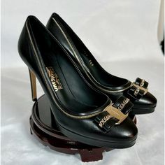 Beautiful And Timeless Black Heels From Famous Designer ‘Salvatore Ferragamo’. 100% Authentic, New In Its Original Box. High Quality Leather With Light Gold (Modern Color) Buckle. Market Value: $1050 (Owner Bought On Sale $745) Sale Price: $545 Condition: Like New. Owner Only Only Unbox, Then Carefully Placed In Box & Designer Shoe Closet. Slightly Sign Of Scratch (Very Tiny) At Shoe Base Due To Trying On. Size: 36.5 Luxury Calf Leather Court Shoes For Work, Luxury Court Shoes For Work With Branded Insole, Luxury Closed Toe Heels For Work, Luxury Court Shoes For Workwear, Luxury Calf Leather Closed Toe Heels, Luxury Calf Leather Heels For Galas, Luxury Calf Leather Heels For Business, Luxury Calf Leather Office Heels, Luxury Calf Leather Heels With Leather Lining