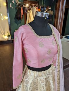 Beautiful pastel pink rawsilk blouse with hand embroidery. Sleeve length can be customised upon request. full flared brocade skirt with lining. soft net dupatta The dress will be made to order in your size. I'll send you a measurement sheet once you order for the measurements. Please convo me if you have any questions or need any customisation. Anarkali Gold Brocade Choli, Gold Anarkali Brocade Choli, Gold Anarkali Choli In Brocade, Designer Pink Brocade Lehenga, Gold Banarasi Silk Choli With Intricate Embroidery, Gold Self Design Raw Silk Lehenga, Pink Raw Silk Gown With Intricate Embroidery, Designer Gold Anarkali Set In Brocade, Gold Raw Silk Lehenga With Self Design