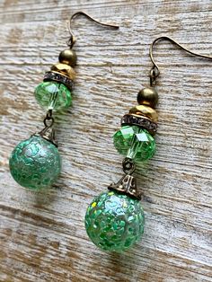 Handmade with vintage marbles found up north Colorado, Crystal & Metal beads. Measures 2.25 inches long. Vintage Czech Glass Matching Earrings, Vintage Adjustable Beaded Earrings, Vintage Beaded Drop Earrings, Vintage Beaded Round Earrings, Vintage Beaded Teardrop Earrings, Vintage Czech Glass Beaded Earrings As Gift, Handmade Vintage Beaded Earrings, Retro Green Drop Earrings, Vintage Gold Beaded Earrings