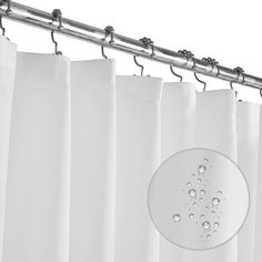 a white curtain with water drops on it and a metal rod hanging from the side