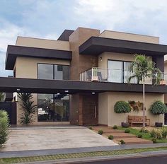 a large house with two balconies on the second floor