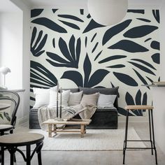 a living room with black and white wallpaper