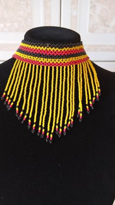 Yellow Zulu Beaded Choker, African Choker necklace, Beaded Necklace for women, Tassel necklace, Fringe Necklace, Christmas giftThis fringe necklace is elegantly crafted using fine Masai beads.It is attractive to wear and very light in weight.It has an adjustable clasp to fit all neck sizes.Main color - Yellow.*Available in different colors kindly select the color option above.Wholesale available at a fair price,please contact me.For any clarification,please send me a convo or an e-mail.****Thank Traditional Adjustable Beaded Fringe Necklaces, Traditional Adjustable Beaded Fringe Necklace, Traditional Beaded Fringe Necklace As Gift, Adjustable Beaded Necklaces With Fringe And Round Beads, Beaded Fringe Necklace With Round Beads As Gift, Gift Necklace With Beaded Fringe And Round Beads, Beaded Fringe Necklaces With Round Beads As Gifts, Adjustable Beaded Necklaces With Beaded Fringe As Gift, Masai Beads