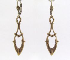 "Art Nouveau Earrings Antiqued golden brass Earrings. Fabulous long dangle Art Nouveau design earrings. Antiqued Brass, nickel free. Measure 2-1/4\" top to bottom. I am happy to switch to french ear wires or clip on if you prefer. Lever back design may vary. Dramatic Beauty...these can be worn every day to Wedding day! Sent to you with Aloha! More of my Artisan Jewelry: hawaiibeads.etsy.com" Gold Brass Plug Earrings For Wedding, Gold Art Nouveau Pierced Earrings, Art Nouveau Gold Pierced Earrings, Victorian Dangle Chandelier Earrings In Brass, Victorian Gold Chandelier Earrings In Brass, Victorian Brass Dangle Chandelier Earrings, Antique Gold Chandelier Earrings In Brass, Art Nouveau Gold Earrings For Wedding, Gold Art Nouveau Earrings For Weddings