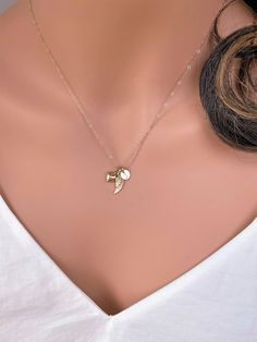 14k solid gold Angle wing , Tiny Initial charm & heart necklace. The best gift for Pet lover necklace . All components onto 14k solid gold . it consists of .. -14k Solid Gold 6.4mm initial charm , 14.5 x 5.3mm Angle wing charm and 11.3 x 6.3mm little puff heart are attached onto -14k Solid yellow gold baby Box chain or Cable chain or Rope chain , -Come up with beautiful jewelry gift box and -One set of Care instruction package . MORE Solid GOLD JEWELRY https://www.etsy.com/shop/rainbowearrin 14k Gold Filled Pendant Charm Necklace As Gift, 14k Gold Filled Pendant Charm Necklace For Gift, 14k Gold Filled Charms Jewelry As Gift, 14k Gold-filled Pendant Charm Necklace For Gift, 14k Gold-filled Charms Jewelry As Gift, 14k Gold Tarnish-resistant Charm Necklace Gift For Her, 14k Gold Tarnish-resistant Charm Necklace For Her, Fine Jewelry Charm Necklace With Heart Charm As Gift, 14k Gold Heart Pendant Jewelry Gift