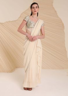 Pre-draped Georgette Lehenga For Designer Wear, Off White Traditional Drape Blouse Piece For Reception, Off White Blouse Piece For Reception With Traditional Drape, Festive Off White Pre-draped Saree, Floor-length Georgette Pre-draped Saree For Reception, Floor-length Georgette Saree For Reception, Draped Georgette Choli For Reception, Off White Pre-draped Saree With Unstitched Blouse For Wedding, Festive Embellished Pre-draped Saree