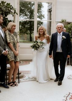 Walking up the aisle: Groomswear: Louis Copeland & Sons, Photographer: SOSTAC Photography, Venue: Kilshane House