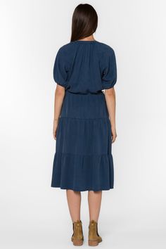 The Cassie midi dress has elbow-length puff sleeves, a v-neck, a drawstring waist for an adjustable fit, and tiered detailing for a contemporary touch. Perfect for both casual and formal occasions. Material: 100% Tencel™ Eco-Friendly Machine wash cold Color: French Navy Oversized, size down if needed. Model is 5'9" and wearing a size S Imported French Navy, Navy Dress, New Tops, Xl Dress, Jacket Outfits, Puff Sleeves, Sweater Jacket, Outerwear Jackets, Denim Dress