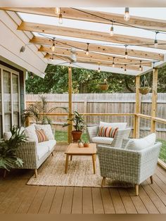 an outdoor living area with couches, chairs and tables on the decking outside