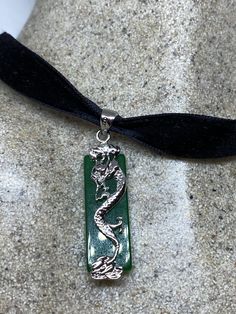 Vintage Green Jade Choker Silver Finish necklace pendant All green color enhanced Jade set in an ornate silver White bronze frame. Over 1 in long All jewelry is shipped in a nice gift box. Check out our over a THOUSAND great reviews Formal Green Engraved Necklace, Engraved Jade Necklaces For Gifts, Engraved Jade Necklace Gift, Gift Engraved Jade Necklaces, Engraved Jade Necklace For Gift, Dark Green Spiritual Jewelry For Gifts, Spiritual Dark Green Jewelry Gift, Spiritual Dark Green Jewelry As A Gift, Green Engraved Pendant Jewelry