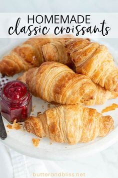 croissants on a plate with jam and butter in the background text reads homemade classic croissants