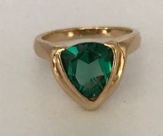 This timeless trillion-cut emerald ring captures the beauty of a boreal evergreen forest. The cut, clarity, color, and carat weight of this emerald are outstanding. Size: 7 Gem Cut: excellent color and clarityWeight: 2.15ctSetting: BezelDWT: 3Gift PouchOnly One AvailableRetail Sells for $1,300Auction Min Offer Price $700Free Shipping via USPS in 2 - 7 DaysQuality Guaranteed Ladies, According to legend over the years, women have bought rings for themselves as personal declarations of independence Evergreen Forest, Etsy Gold Ring, Yellow Gold Ring, Natural Emerald, Emerald Ring, Yellow Gold Rings, Gold Ring, Gold Rings, Emerald