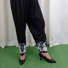 Embroidered Silk Shalwar pants Pakistani/Indian style bottoms. Unique style. Pair this embroidered shalwar pants with crop top. These style bottoms are in trend right now. This creates a classic and elegant look that is easy to wear and will get you noticed for sure Detail & Measurement : Front Belt Half Elastic Flexible Sizes Quality Stitching NOTE :  There might slightly color variation due to different color settings. Please send us a message if you have any questions or concerns Care Instructions: Iron with less heat. Traditional Embroidered Ankle-length Bottoms, Spring Embroidered Ankle-length Bottoms, Traditional Wide Leg Bottoms With Elastic Waistband, Traditional Pants With Embroidered Border For Festivals, Traditional Wide-leg Bottoms With Chikankari Embroidery, Traditional Wide Leg Bottoms With Chikankari Embroidery, Traditional Trousers For Eid, Traditional Cotton Wide Leg Sets, Traditional Cotton Sets With Wide Leg