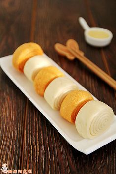 a plate with some food on it and chopsticks next to it