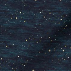 an image of stars in the sky with blue and gold colors on it's surface