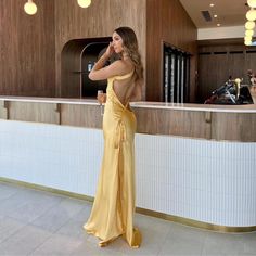 Jessica Gold Silk Maxi Dress - Shop Now - Aunomay Gold Dress Silk, Yellow Satin Gown For Party, Yellow Fitted Satin Gown, Yellow Satin Party Gown, Elegant Yellow Dress For Date Night, Gold Backless Dress For Formal Occasions, Elegant Gold Backless Dress, Gold Satin Maxi Dress For Date Night, Elegant Yellow Backless Dress