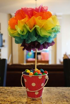 a candy filled bucket sitting on top of a table