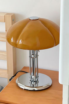 a lamp sitting on top of a wooden table