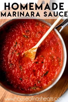 homemade marinara sauce in a pan with a wooden spoon and text overlay that reads homemade marinara sauce