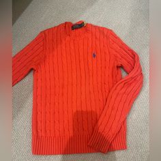 Super Comfortable Sweater. Never Worn!!! Red With A Blue Raulph Lauren Logo. Red Cotton Cable Knit Sweater, Red Cable Knit Cotton Sweater, Ralph Lauren Long Sleeve Cable Knit Sweater, Ralph Lauren Long Sleeve Knit Sweater, Ralph Lauren Knit Tops For Fall, Red Fitted Ralph Lauren Tops, Casual Ralph Lauren Sweater, Fitted Red Ralph Lauren Tops, Ralph Lauren Red Crew Neck Top