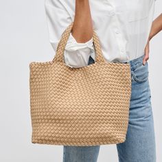 Woman wearing Nude Sol and Selene Sky's The Limit - Medium Tote 841764107785 View 1 | Nude Neoprene Tote, Exterior Details, Flying High, Glass Ceiling, Medium Tote, Mini Tote, New Instagram, A Bag, Interior Details