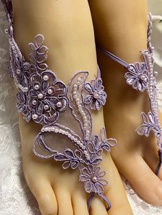 Beautiful lavender lace barefoot sandals with pearls and sequins are hand stitched with a matching soft elastic. One size mostly fits all but sometimes is a little too big or small. Choose your shoe size on the drop box and I will make them your shoe size. Amazing for beach weddings,  wear them with your sandal, shoes, for a walk on the beach, yoga, belly dancing, fancy event flower girl, pool party. Beaded Lavender, Lace With Pearls, Lace Barefoot Sandals, Fancy Event, Beach Yoga, Drop Box, Sandal Shoes, Event Flowers, Flower Lace