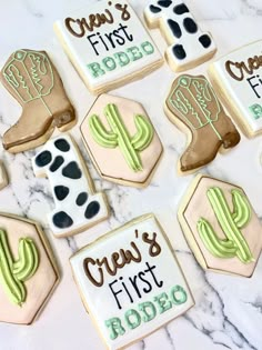 decorated cookies with the words crew's first rodeo on them