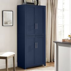 a tall blue cabinet in a living room