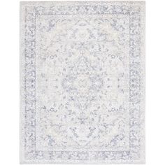 a white and blue rug with an ornate design on the center, in front of a white background