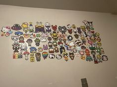 there are many stickers on the wall in this room that is decorated with cartoon characters